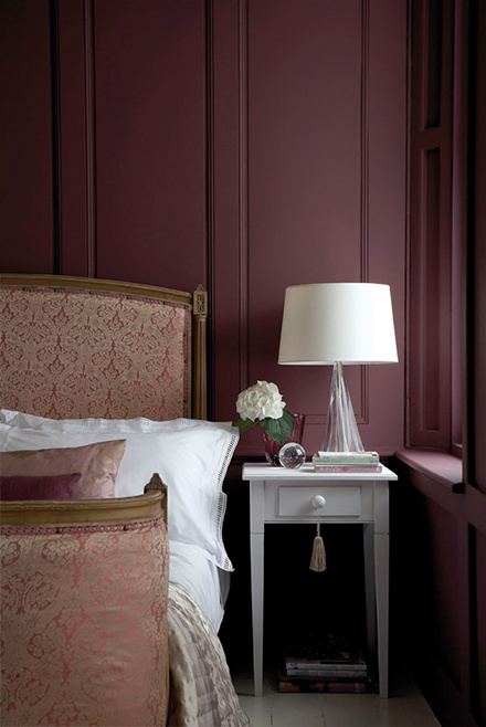 Bedroom drenched in Little Greene Adventurer — plum-aubergine ceiling and walls