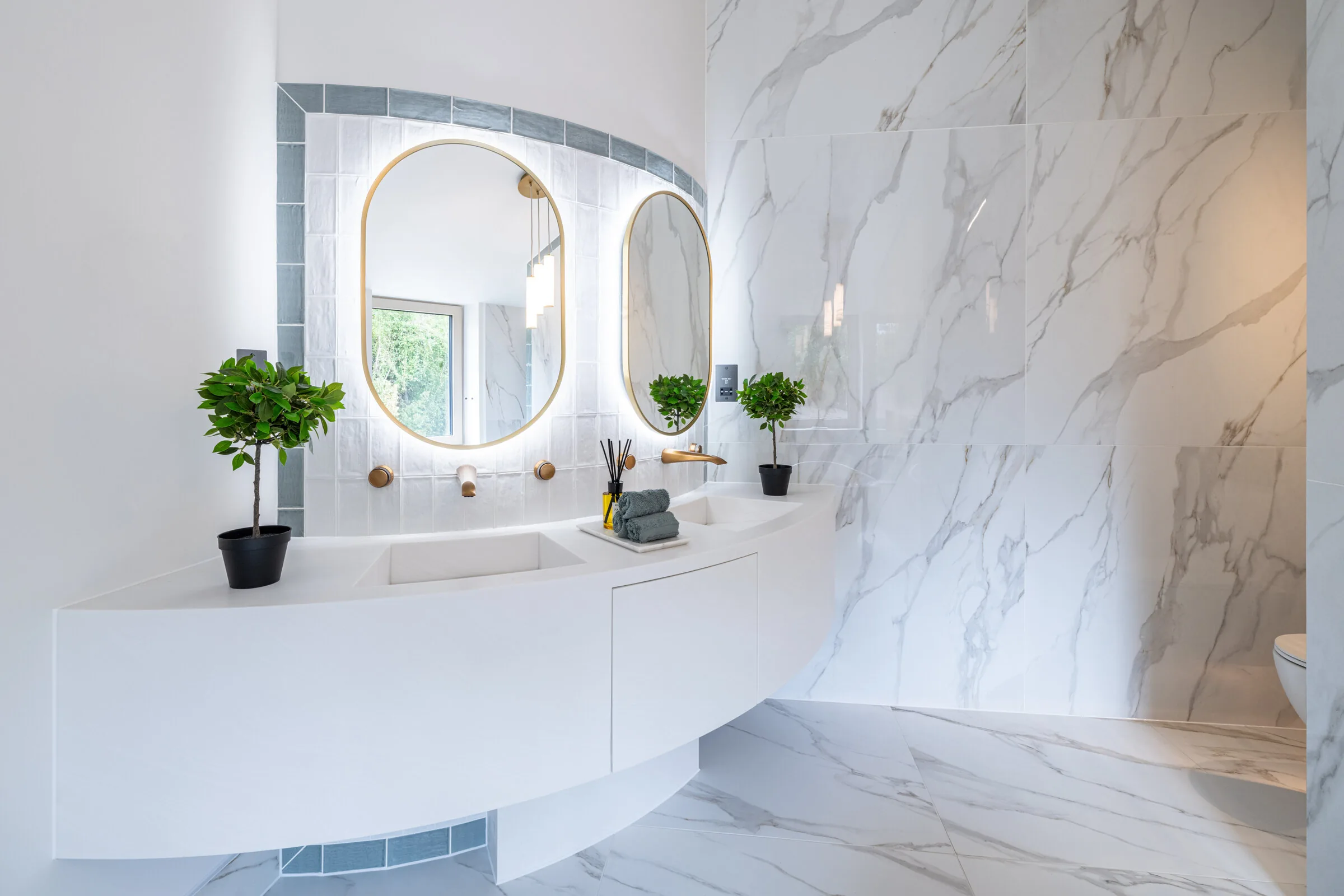 Cranberryhome interior — Queens Orchard ensuite bathroom with marble vanity and warm brass detailing