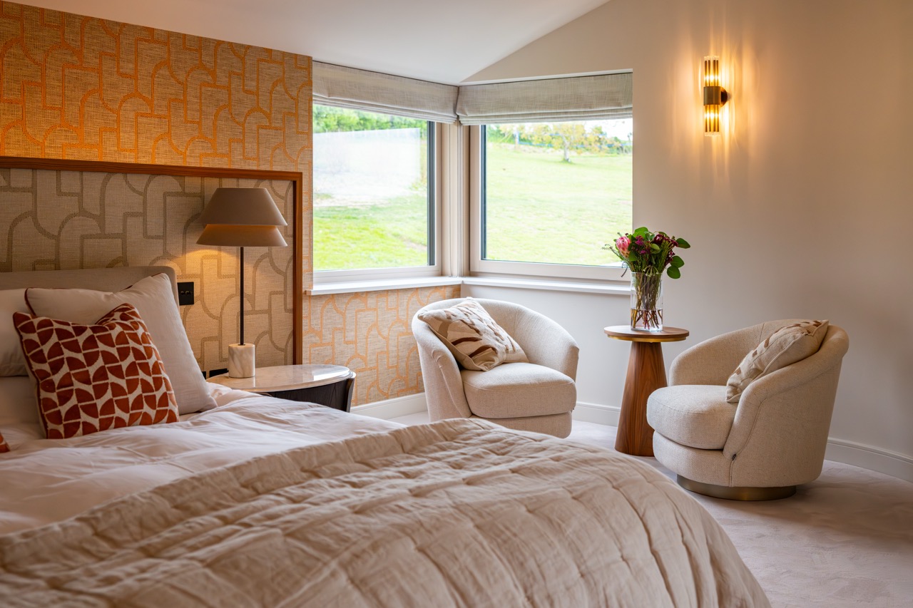 Queens Orchard master bedroom seating area with corner window over the grounds