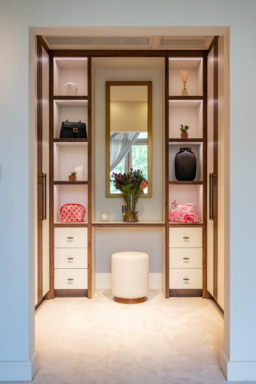 Queens Orchard bespoke dressing room with walnut vanity and fitted storage