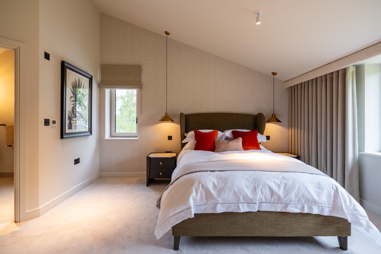 Queens Orchard guest bedroom with olive headboard and vaulted ceiling