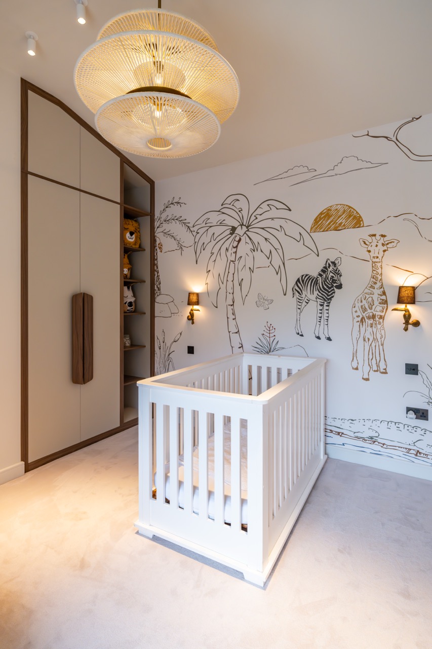 Queens Orchard nursery with hand-painted safari mural and bespoke wardrobe