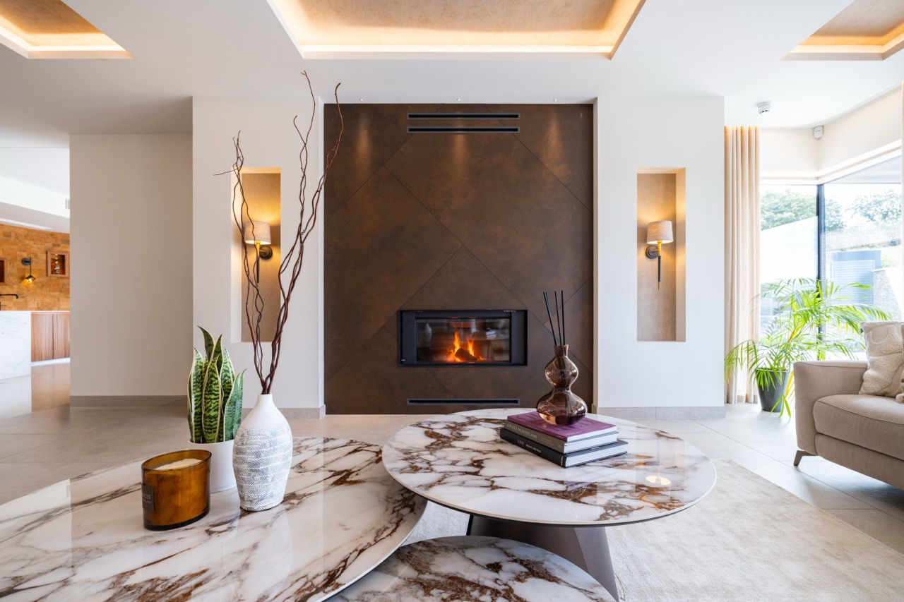 Queens Orchard living room fireplace with marble coffee tables