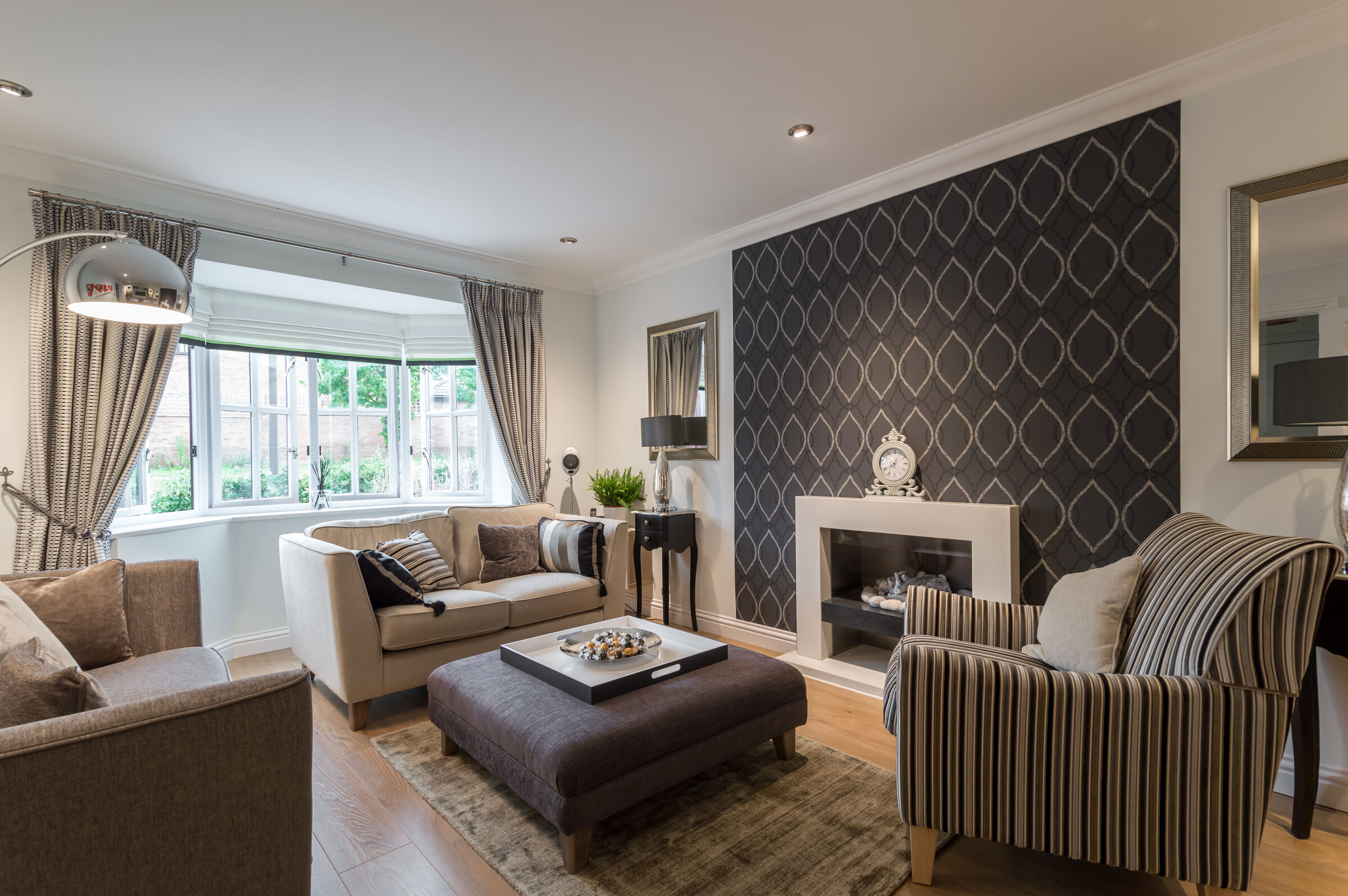 Shenley Brook End living room — relaxed seating, layered lighting, calm tones